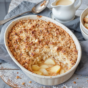 Classic apple crumble dessert, a sweet treat with a crunchy topping and tender baked apples.