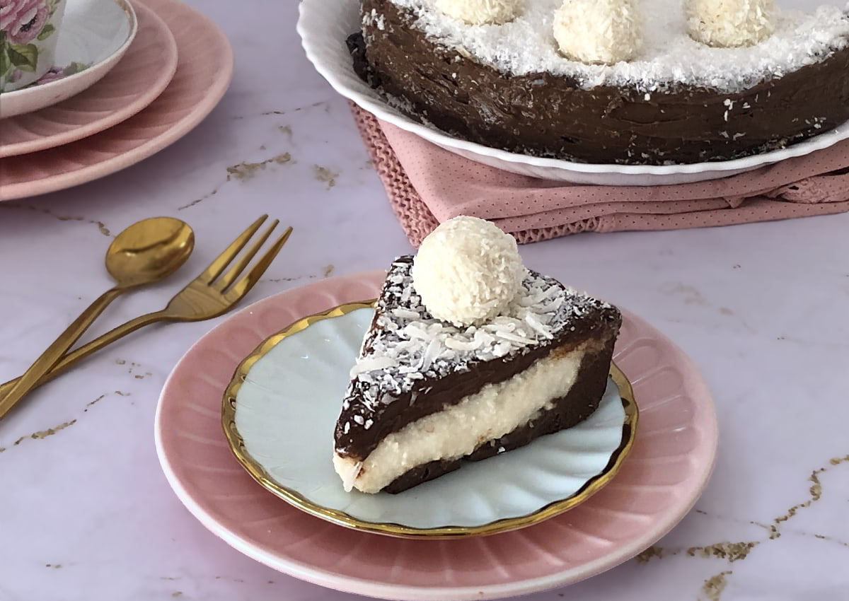 Slice of coconut cream pie with chocolate ganache showing the balance of creamy coconut and rich chocolate layers — why this recipe works perfectly.