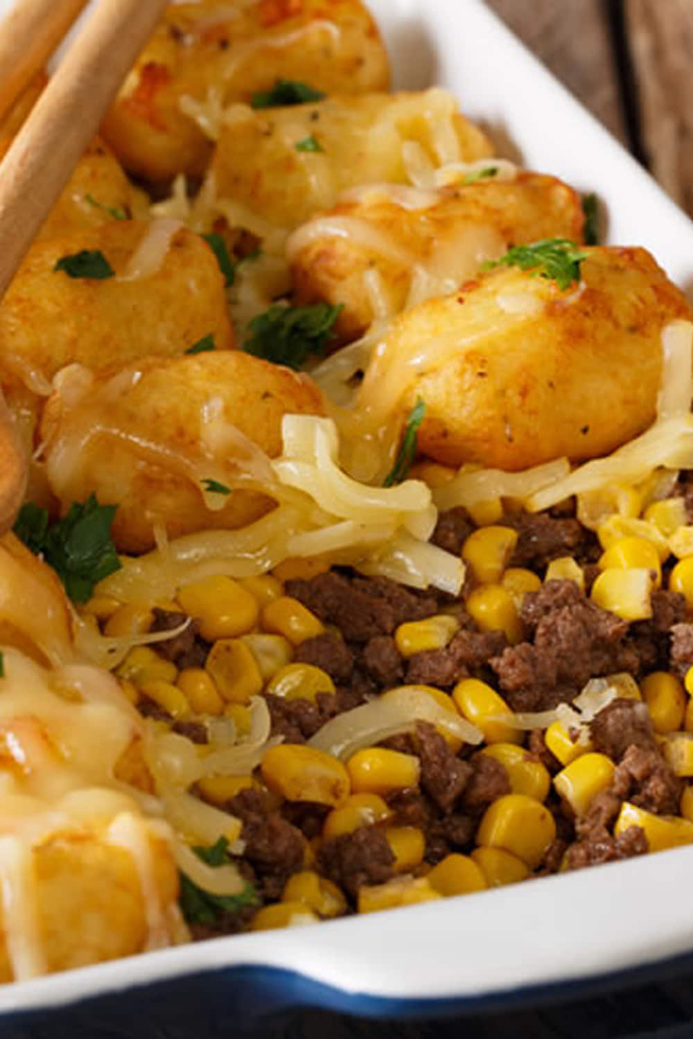 Crispy baked Tater Tot Casserole with ground beef, cheddar cheese, and corn