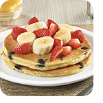 Stack Of Double Berry Banana Strawberry Pancakes