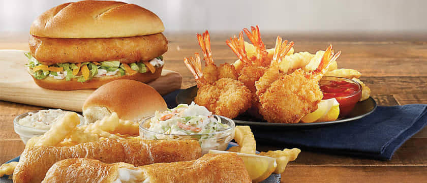 Indulge in a scrumptious meal at Culver's fish menu prices! Picture a table showcasing a tempting sandwich, golden fries, and a plate brimming with delicious food. Get ready to satisfy your cravings!